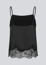 Delicate satin top in black with lace details on the bottom. Vuemd top has adjustable straps and refined lace details at the hem. Perfect worn alone or styled as part of a layered look.