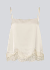 Delicate satin top in white/cream with lace details. Vuemd top has adjustable straps and refined lace details at the hem. Perfect worn alone or styled as part of a layered look.
