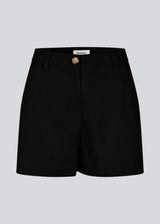 Black high-waisted shorts with side pockets. NormaMD shorts have a zip fly and button, belt loops, and decorative paspoil pockets on the back.