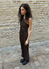 Dark brown maxi one-shoulder dress in satin. NarcissaMD dress has an open back with beautiful details and an invisible zipper on the side.