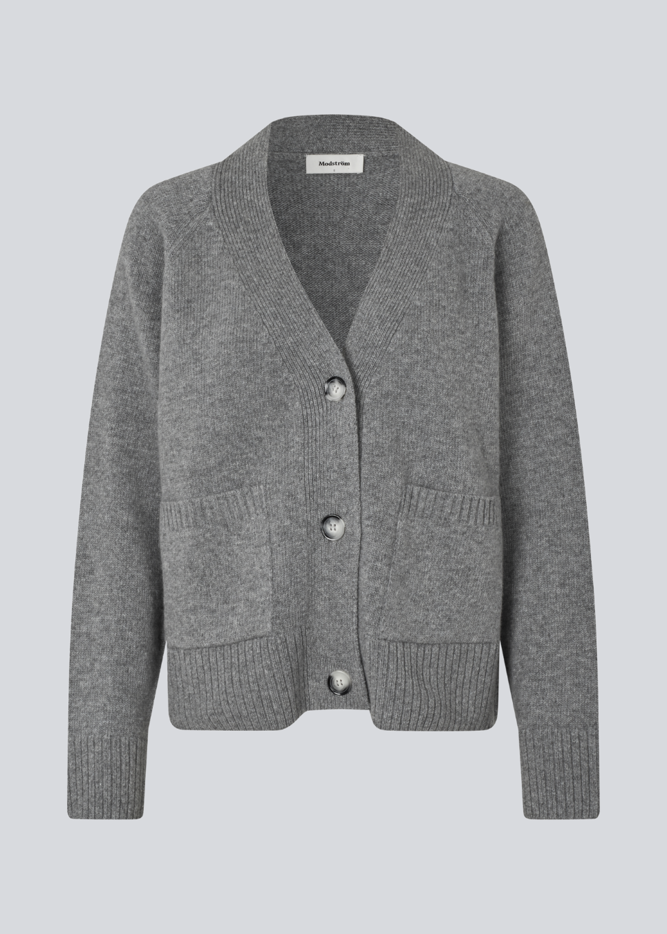 Grey knitted V-neck cardigan in 100% wool. Petunamd cardigan has long wide sleeves and two front pockets.