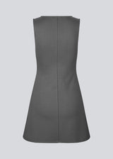 Fitted mini dress in an A-line shape with a round neck and no sleeves. JosefineMD tank flare dress is made from a stretchy material. The model is 177 cm and wears a size S/36.