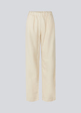Long pants in beige with a relaxed fit and long wide legs and an elasticated waist for extra comfort. TulsiMD pants are made from a soft mix of linen and rayon.