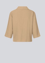 Shirt in beige in a relaxed silhouette and 3/4 length sleeves. AaliyahMD shirt has a resort collar, dropped shoulders and button closure in front.  The model is 177 cm and wears a size S/36.