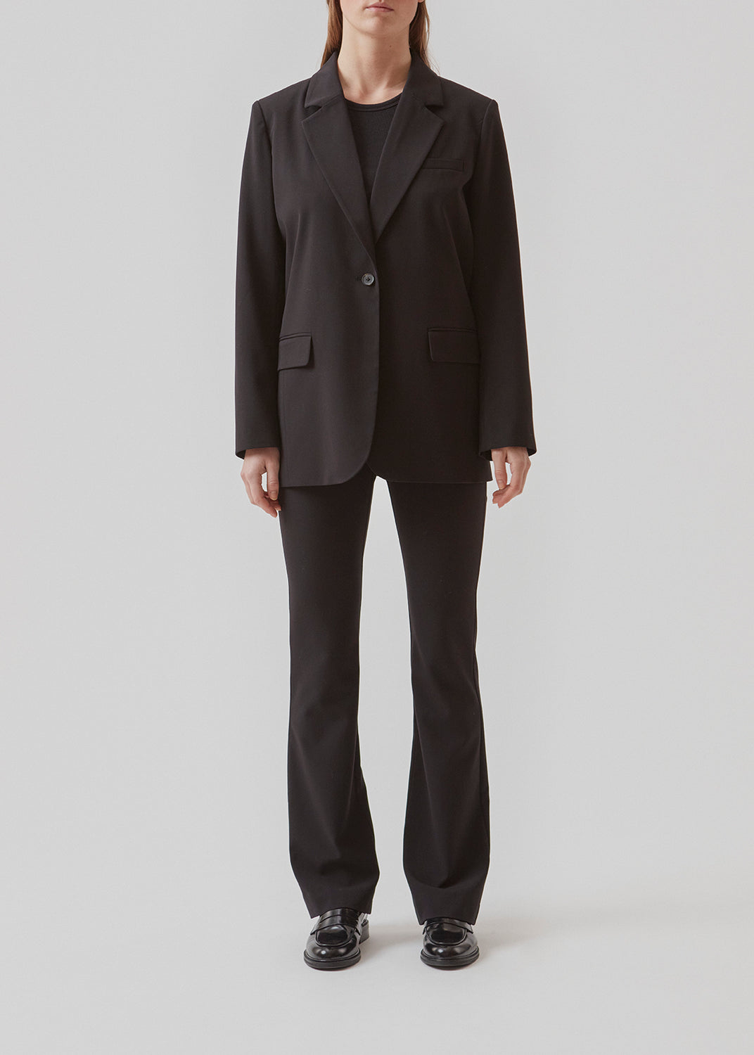 Oversized blazer with a drapey fit. AnkerMD blazer has collar and notch lapels with a single button closure. Flap welt front pockets. Slits on cuffs and single back vent. Lined.  Buy matching pants or skirt: AnkerMD pants, AnkerMD wide pants or AnkerMD skirt, in the same color to complete the look.