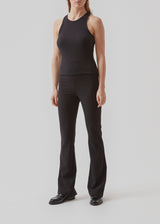 Pants in a slim silhouette with hidden closure at one side. AnkerMD slit pants have decorative paspel back pockets, sewn-in creases, and slits at hems.  Buy matching blazer: AnkerMD blazer, in the same color to complete the look.
