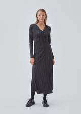 Tight dress in the color: Love Love Blue stretchable quality with print and A shape.BartoMD dress has long sleeves and V-neckline with wrinkle detail at the waist.