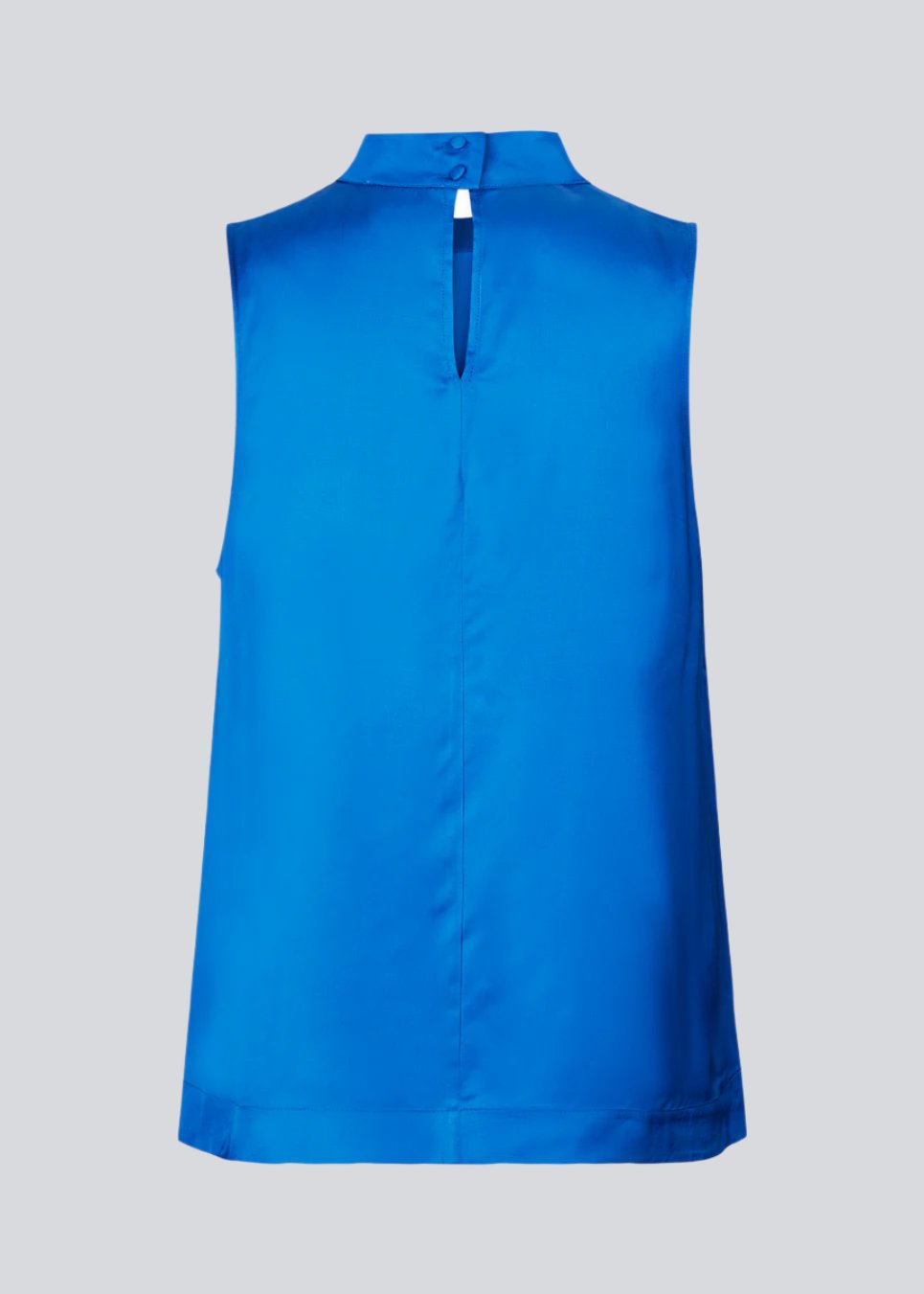 Sleeveless top in blue with a loose fit with a high neck and a small opening with button closure at the back. BeateMD top is crafted from a more resposible, softly draping satin.