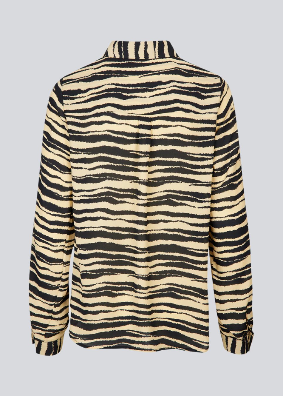 Shirt made from recycled materials. BeckyMD print shirt offers a relaxed fit with wide sleeves with cuff, shirt collar, and button closure in front.
