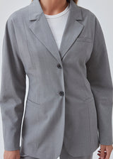 Slim-fitted blazer in grey with voluminous sleeves and soft shoulders. BennyMD blazer features buttons, pospoil pockets, a collar, and a notch lapel. No slit on the back.  Match with pants: BennyMD pants.