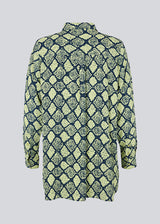 Relaxed, long shirt with a loose-fit silhouette in snake print. CamilaMD print shirt is designed with long sleeves with cuff, collar, and buttons in front. The model is 177 cm and wears a size S/36.