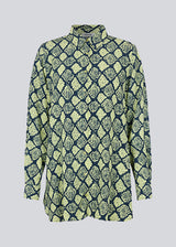 Relaxed, long shirt with a loose-fit silhouette in snake print. CamilaMD print shirt is designed with long sleeves with cuff, collar, and buttons in front. The model is 177 cm and wears a size S/36.