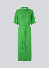 Long shirt dress with short wide sleeves, collar, buttons in front, and tiebelt at the waist. CashMD long dress is crafted from an EcoVero viscose. The model is 174 cm and wears a size S/36.