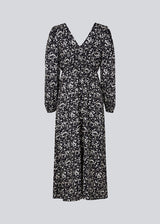 Long dress with elasticated puff sleeves, v-neckline in both front and back, and an elastic detail at the waist. CelineMD print dress is made from an EcoVero viscose with floral print.