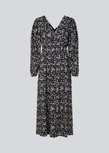 Long dress with elasticated puff sleeves, v-neckline in both front and back, and an elastic detail at the waist. CelineMD print dress is made from an EcoVero viscose with floral print.