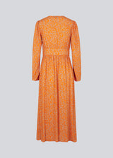 Long dress with puff sleeves and floral print in EcoVero viscose. CorinnaMD print dress is designed with buttons in front and a pretty detail at the waist.