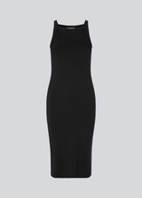 Tight fitted basic black dress in organic cotton jersey. DaeMD dress is sleeveless with a high and straight neckline. The dress cuts below the knees. The model is 177 cm and wears a size S/36.