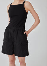 Cargo shorts in black in nylon with wide legs. DilaraMD shorts have an elasticated waistband and two large patch pockets on the sides. The model is 177 cm and wears a size S/36.