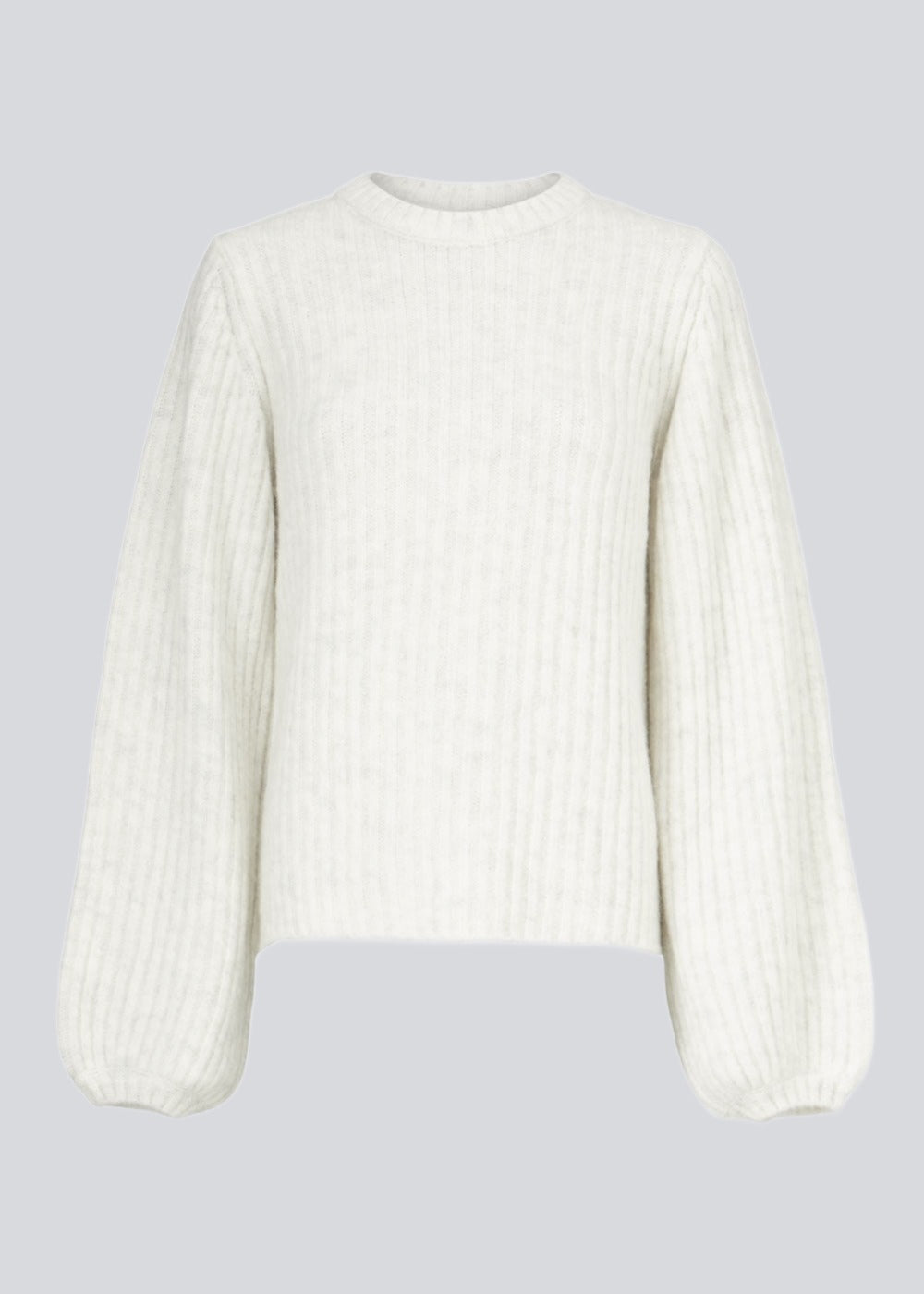 Simple white rib knit with a slim silhouette, voluminous balloon sleeves and a round neckline. The trim on the sleeves and neckline is knitted in a smaller rib. Goldie o-neck is made from an alpaca blend that adds a luxurious feel and look.