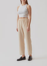 Basic top cut from a soft ribbed jersey fabric. IgorMD crop top in the color Off White is styled with a slim fit and cropped fit with racer-shaped back. Perfect for a sporty look. The model is 173 cm and wears a size S/36