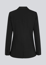 Classic fitted blazer. The Kendrick blazer is closed at the front with a single button and has front pockets. Kendrick Blazer in Black is a Modström Bestseller and a must-have black Blazer as a basic styles in your waredrobe.