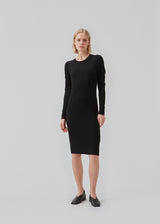 Dress in rib knit with long puff sleeves and a round neck. The quality of KrownMD puff dress is stretchy and more responsible.  The model is 177 cm and wears a size S/36.
