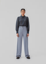 Classic shirt in dark blue in a light and airy material. Oskar shirt has a relaxed fit with voluminous balloon sleeves finished with a wide cuff. The shirt is a bit sheer for an ultra-feminine expression. The model is 174 cm and wears a size S/36.