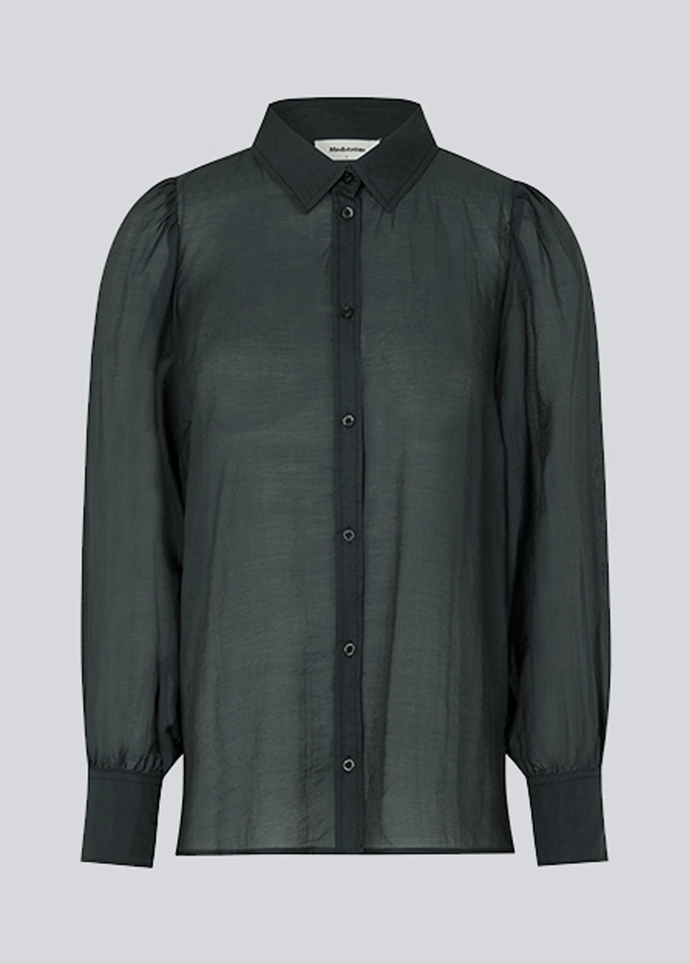 Classic shirt in dark blue in a light and airy material. Oskar shirt has a relaxed fit with voluminous balloon sleeves finished with a wide cuff. The shirt is a bit sheer for an ultra-feminine expression. The model is 174 cm and wears a size S/36.