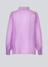 Classic shirt in a purple, light and airy material. Oskar shirt has a relaxed fit with voluminous balloon sleeves finished with a wide cuff. The shirt is a bit sheer for an ultra-feminine expression.
