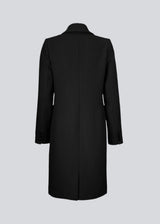 Beautiful, long wool coat in black. Pamela coat is closed by 3 big buttons at front and is waisted, which gives a feminine look. Because of the high content of wool you will be able to keep warm all through fall and the mild winters.