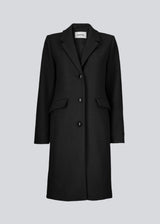 Beautiful, long wool coat in black. Pamela coat is closed by 3 big buttons at front and is waisted, which gives a feminine look. Because of the high content of wool you will be able to keep warm all through fall and the mild winters.