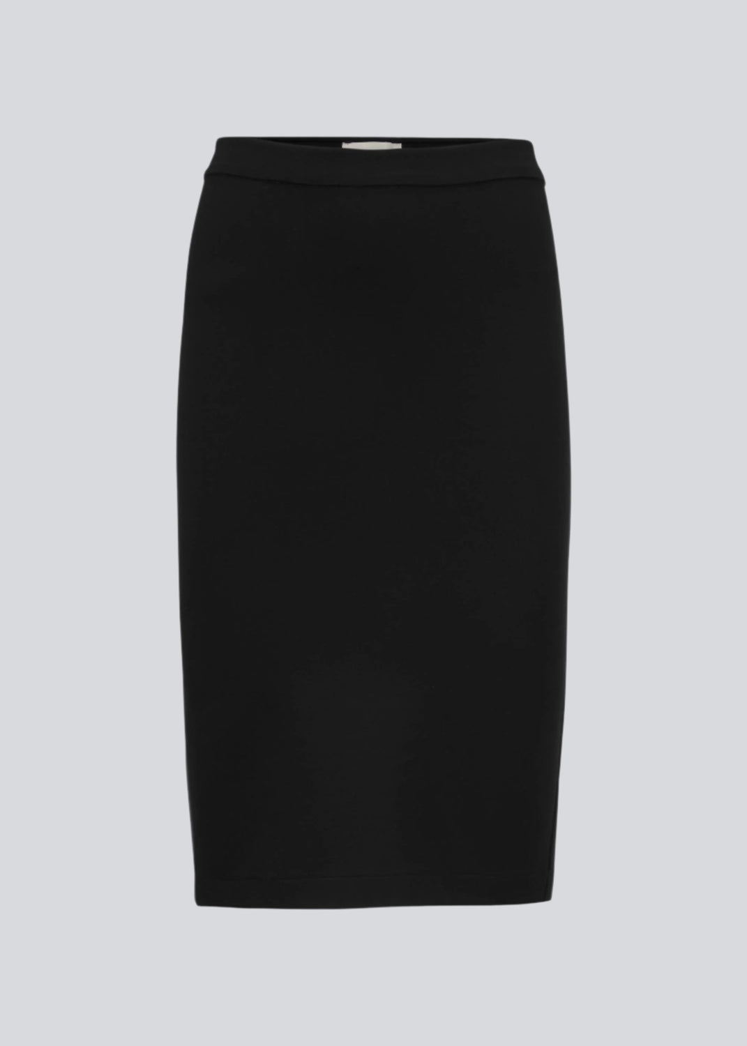 Simple, stylish and a must-have tight skirt. Tanny skirt is knee length and has a small slit at the back. The stretchable material creates a perfect fit. The model is 174 cm and wears a size S/36