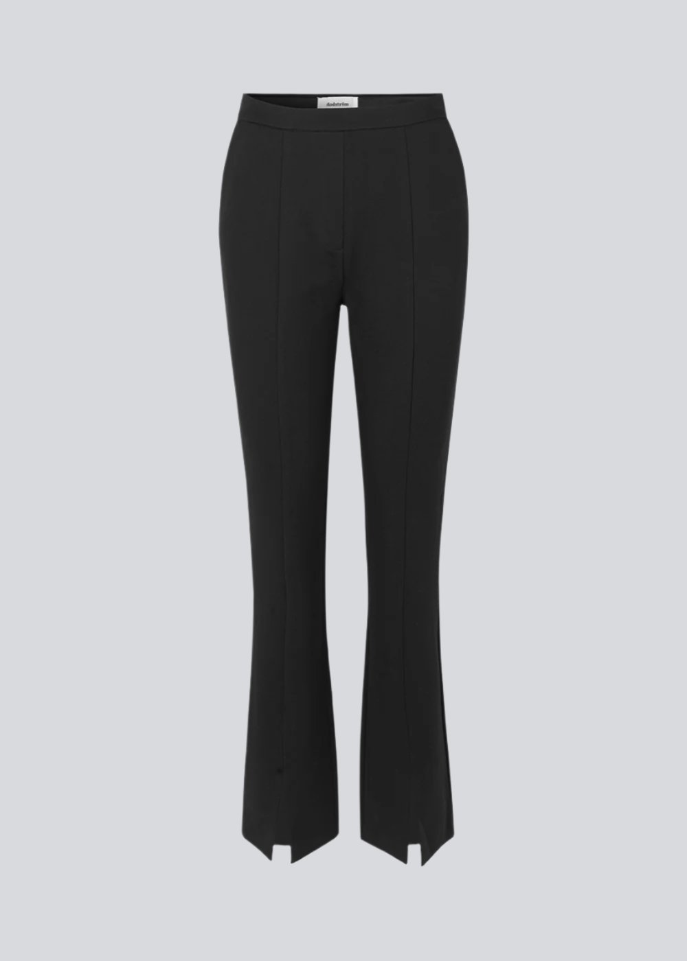 Nice pants in a soft quality with stretch. Tanny slit pants has a simple design with an elasticated waistline and a tight fit. The slit detail at the hem creates more width and effect at the bottom.