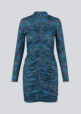 Short dress in the color Malibu Poerty Flower, with long sleeves and low collar. TilloMD print dress is designed with a slim shape with a wrinkled, elastic detail down the center front and center back.