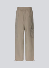 Cargo pants in nylon with elastic waistline and adjustable hems with elastic drawstrings. TrentMD pants have patch pockets on the legs. In Spring Stone.  This is the same model as our popular pants AmayaMD pants. Just in a thicker material, perfect for fall and winter.