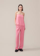 Pants in pink in a relaxed fit. AnkerMD wide pants have a regular waist with pleats in front and wide, long legs. Decorative back pockets and side pockets.  Match with blazer: AnkerMD blazer