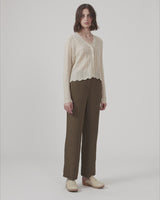 Wide-legged pants in the color Dark Forest in a patterned satin. CarmelMD pants have a medium waist with zip-fly, button closure, and elastic in the back for extra comfort. The model is 177 cm and wears a size S/36.  Shop matching shirt: CarmelMD shirt.