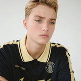 Football jersey made in collaboration with the Danish football team Brøndby Women. The 1971 Polo in navy with yellow details features a loose fit, with a placket closure and collar, as well as long sleeves that have ribbed cuffs. The polo features Brøndby Women and Modström logos on the chest.