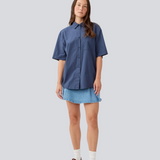 Shortsleeved shirt with a loose fit. MaudeMD SS shirt has cheast pocket, shirt collar and a button closure in front.