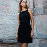 Tight fit basic black top with a high and straight neckline. DaeMD top is made from a rib-knitted organic cotton. The model is 177 cm and wears a size S/36.