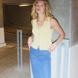 Sleeveless lace top in yellow with a v-neck. MamumdMD top is fitted and has a button closure in front.