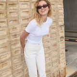 Flared jeans in white with of cotton denim. IsoldeMD solid cropped jeans have a high waist, zipper fly, and front and back pockets.

The model is 175cm and wears a size 27 (small).