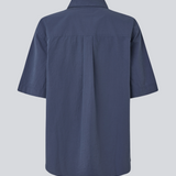 Shortsleeved shirt with a loose fit. MaudeMD SS shirt has cheast pocket, shirt collar and a button closure in front.