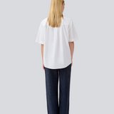 Shortsleeved shirt with a loose fit. MaudeMD SS shirt has cheast pocket, shirt collar and a button closure in front