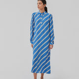 Relaxed long shirt dress with collar, button placket, and long puff sleeves. CenniMD print dress is cut from an EcoVero viscose with diagonal stripes.