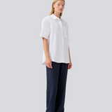 Shortsleeved shirt with a loose fit. MaudeMD SS shirt has cheast pocket, shirt collar and a button closure in front