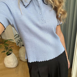Fitted polo in jersey. MagdaloneMD polo has short sleeves and babylock edges.