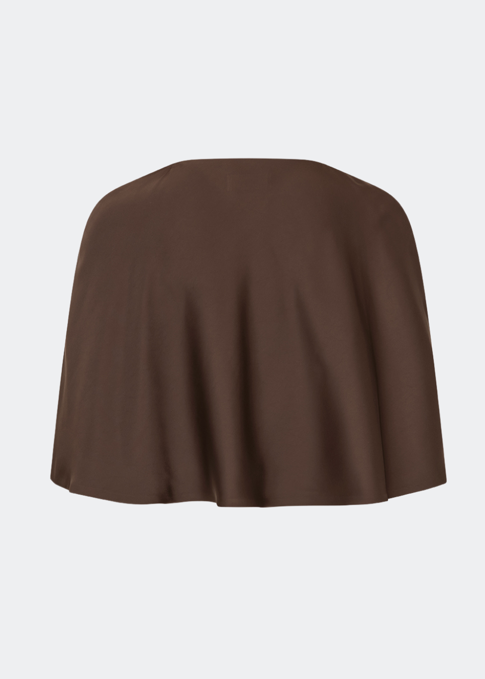 Tailormd Cape is an elegant satin cape designed to add a refined and dramatic finish to any outfit. It drapes effortlessly over the shoulders and fastens at the front with a decorative knot detail, creating a soft, fluid silhouette. Layer it over a dress for special occasions or style it with a simple top for an elevated, sophisticated look. The model is 175 cm tall and is wearing a size S/36.