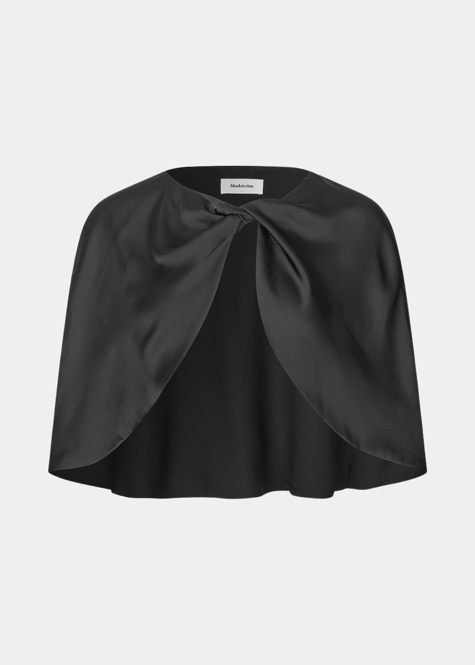 Tailormd Cape is an elegant satin cape designed to add a refined and dramatic finish to any outfit. It drapes effortlessly over the shoulders and fastens at the front with a decorative knot detail, creating a soft, fluid silhouette. Layer it over a dress for special occasions or style it with a simple top for an elevated, sophisticated look. The model is 175 cm tall and is wearing a size XS/S.
