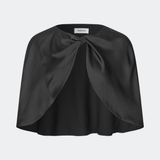 Tailormd Cape is an elegant satin cape designed to add a refined and dramatic finish to any outfit. It drapes effortlessly over the shoulders and fastens at the front with a decorative knot detail, creating a soft, fluid silhouette. Layer it over a dress for special occasions or style it with a simple top for an elevated, sophisticated look. The model is 175 cm tall and is wearing a size XS/S.
